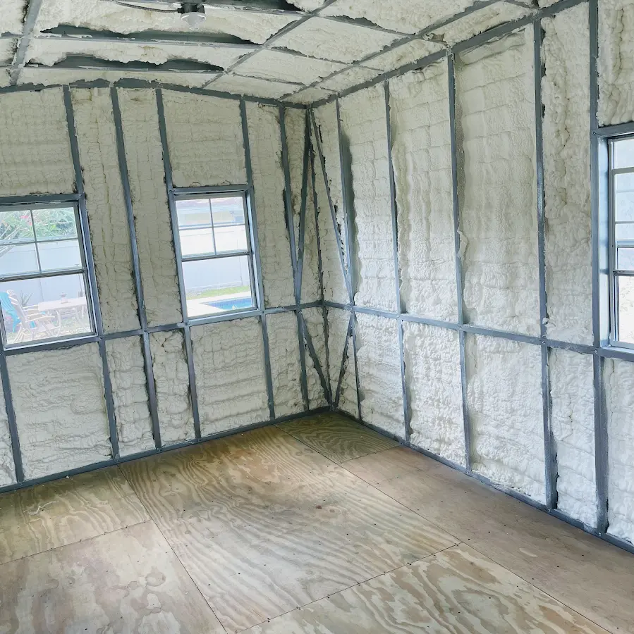 Closed-cell spray foam insulation applied to wall cavities in a residential project in Burien